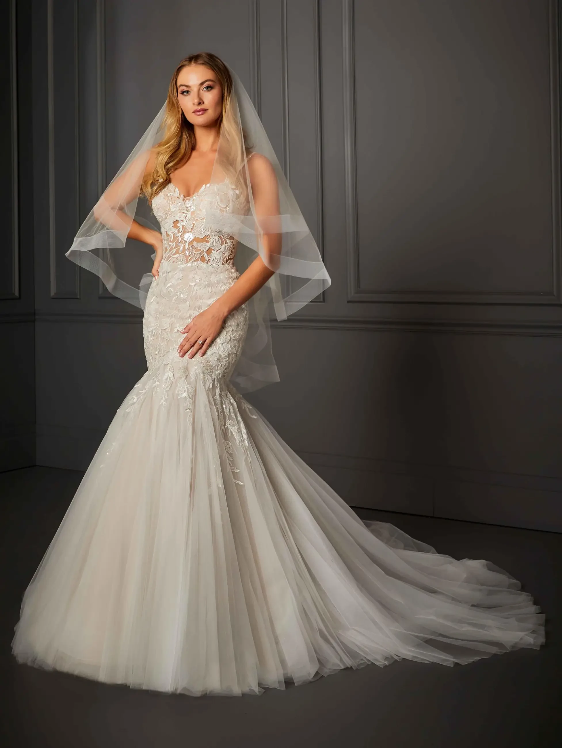 model is wearing a strapless mermaid bridal gown