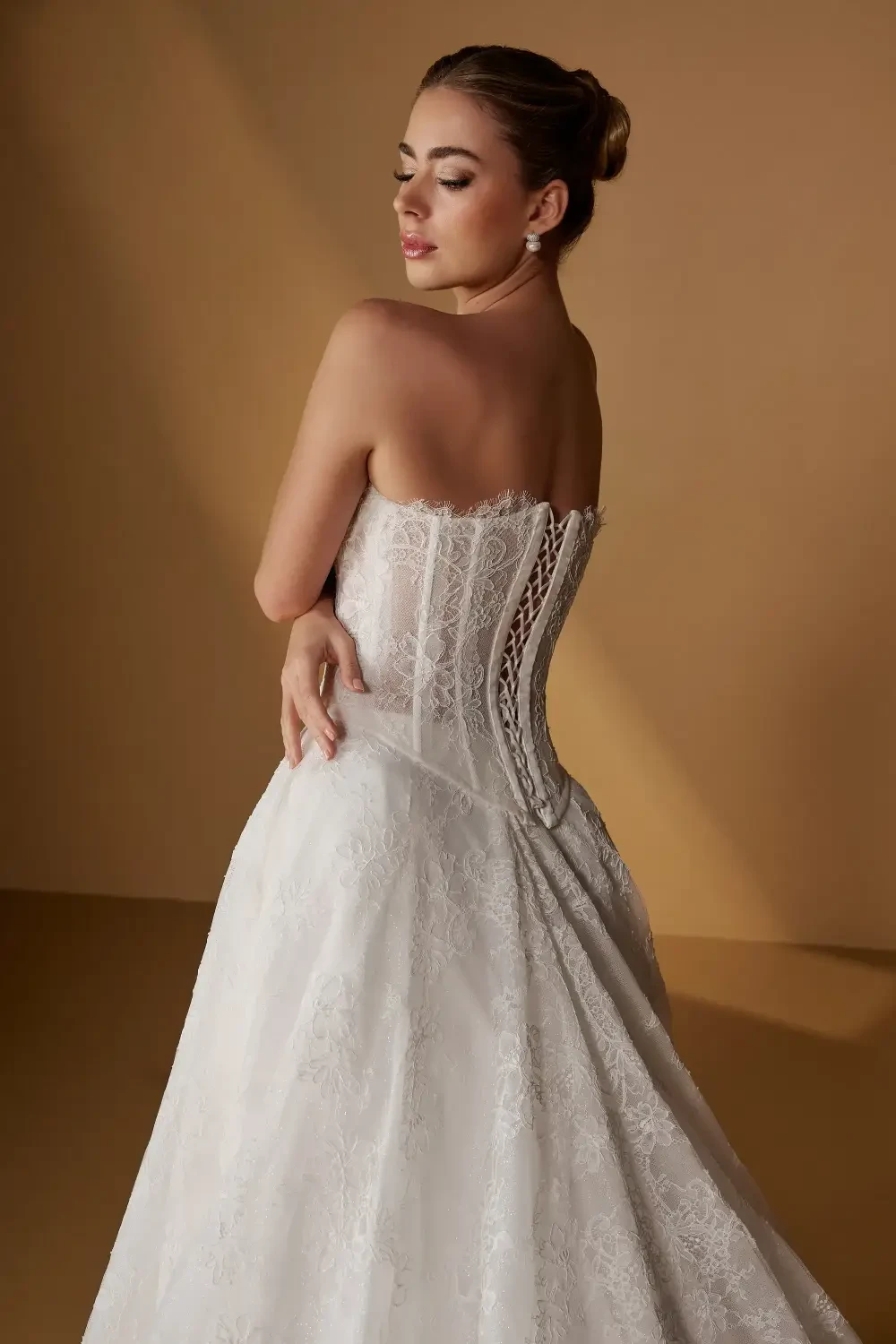 model is wearing a strapless bridal gown