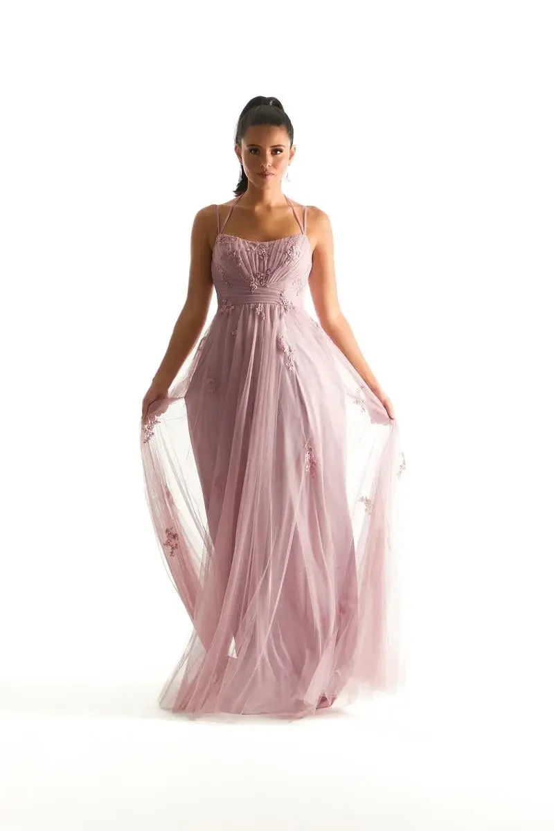 Model is wearing a scoop neck bridesmaid dress with a halter neckline by morilee