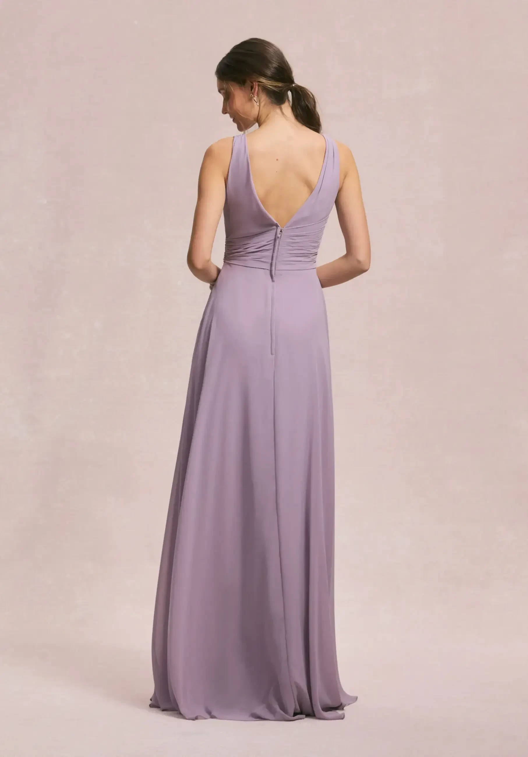 model is wearing a light purple v-neckline bridesmaid dress