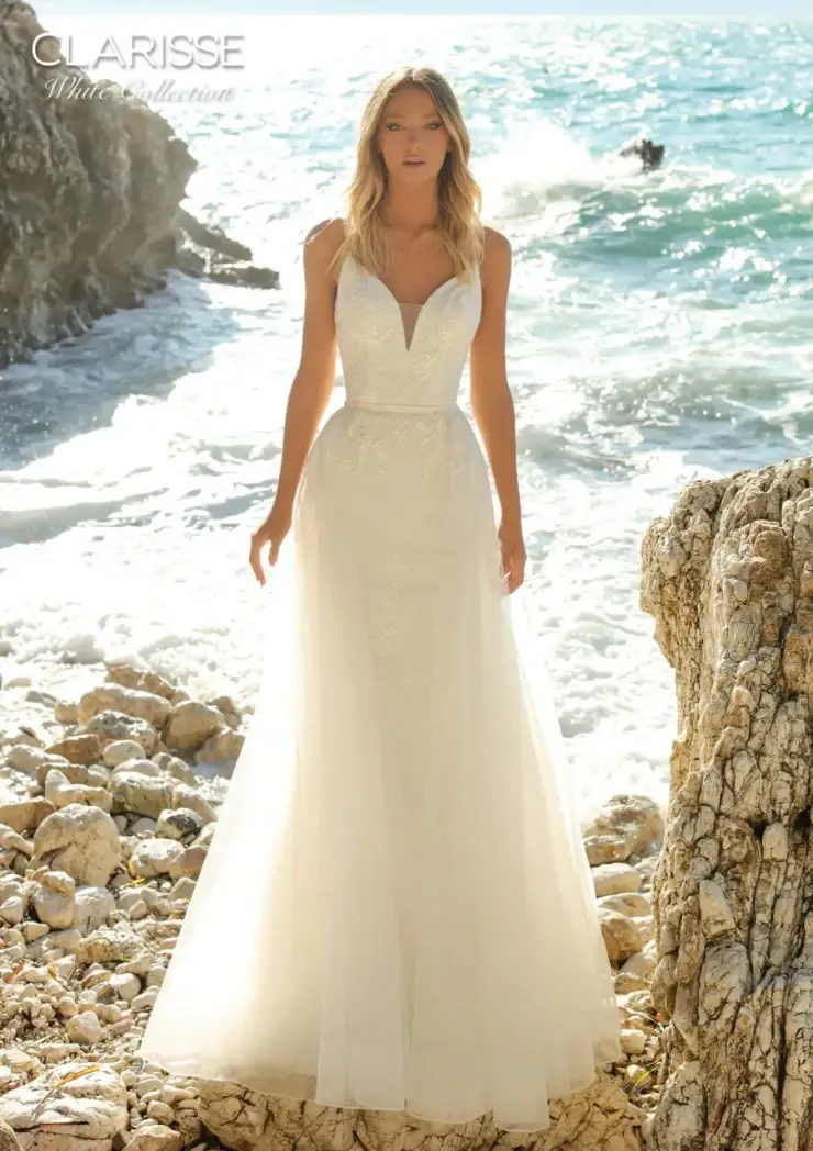 model is wearing a sleeveless a-line open back wedding gown