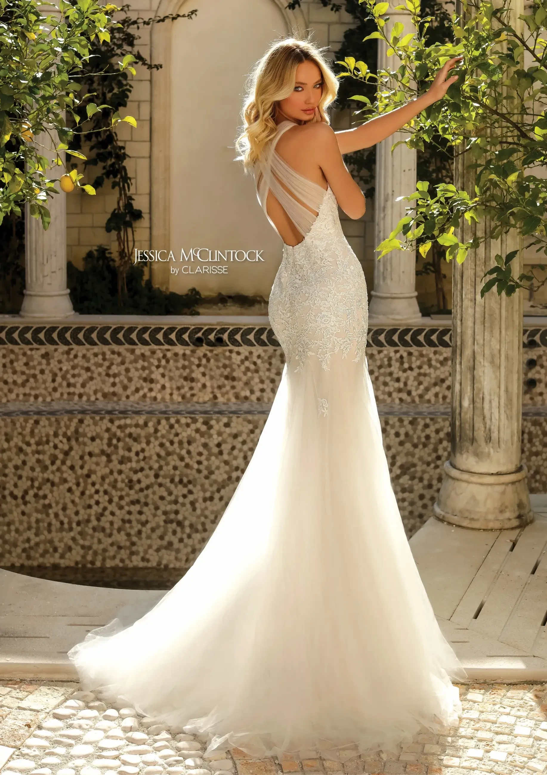 model is wearing a sleeveless mermaid bridal gown